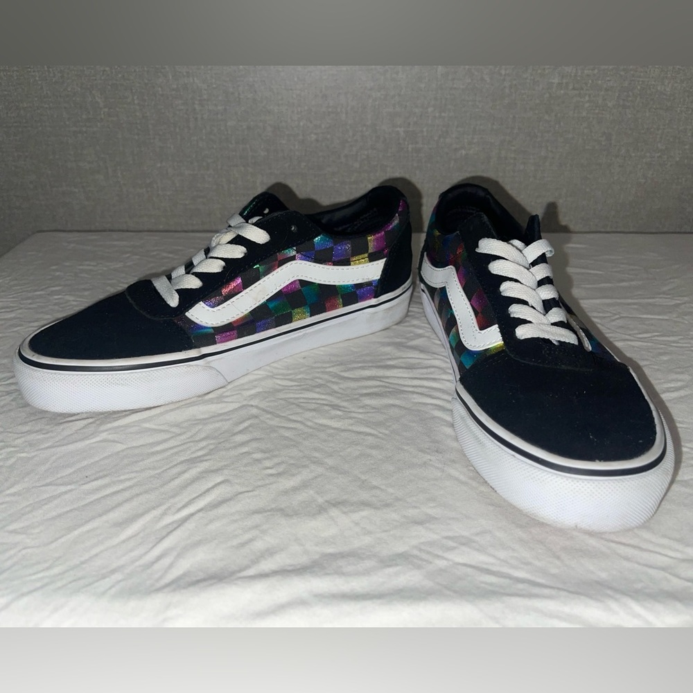 Metallic rainbow checkered low top Vans.